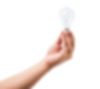 Person holding lightbulb.