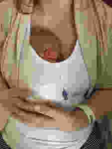 Lady holding her baby skin to skin