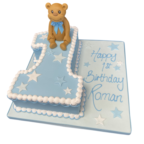 Adorable Teddy Bear themed cake with a number one on top, perfect for a first birthday celebration, featuring a cute teddy bear decoration.