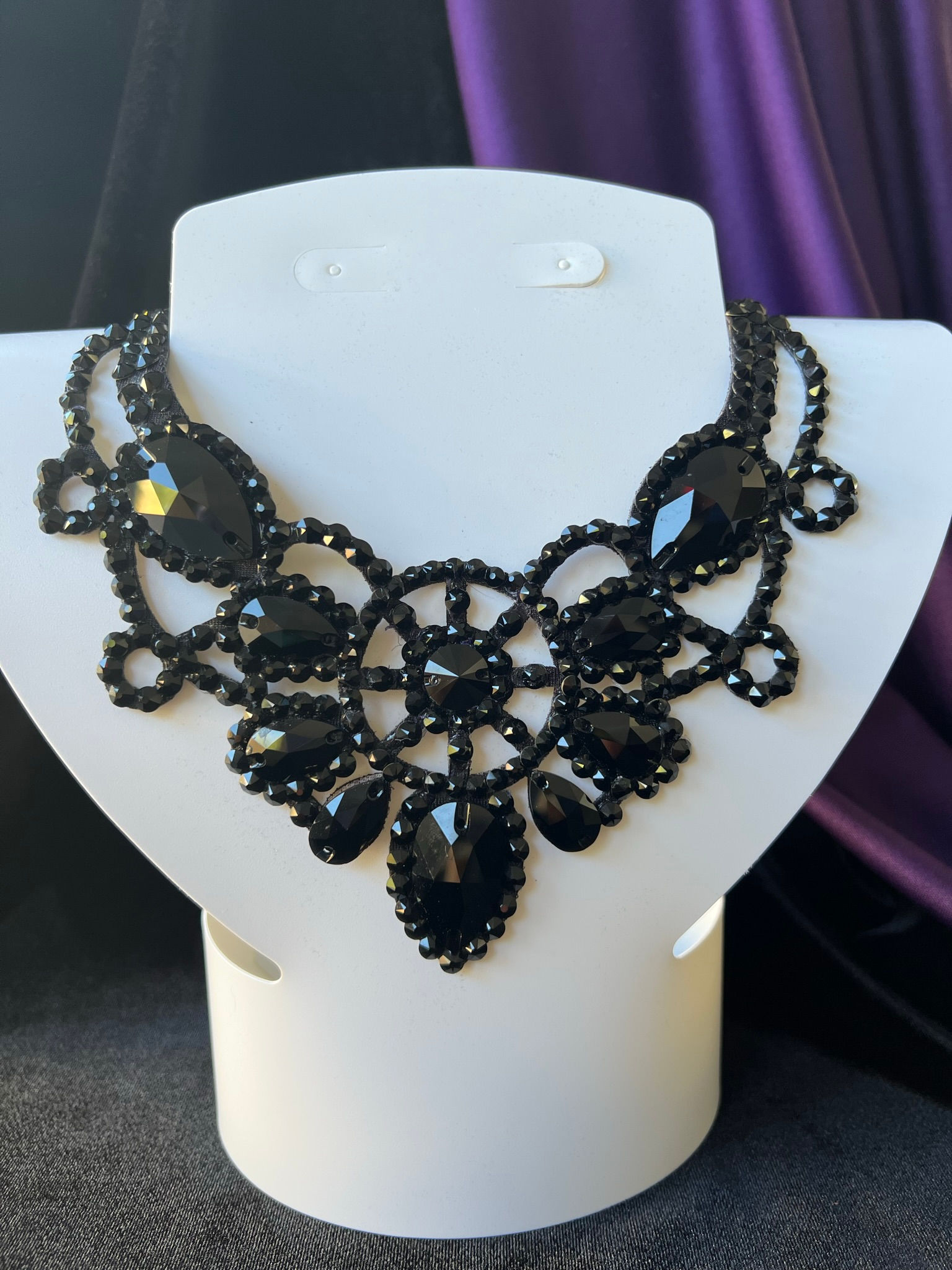 detailed crystal necklace with center medallion design for performance