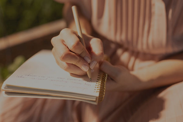 close-up-hand-writing-notebook_edited_edited_edited.jpg