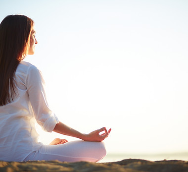woman-sitting-yoga-pose-beach.jpg