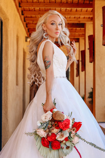 Bride portrait inside adobe corridor at desert wedding venue