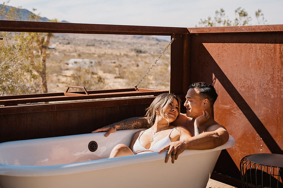 A Couple Enjoys Outdoor Soaking Tub at Sacred Sands Lobo Luna