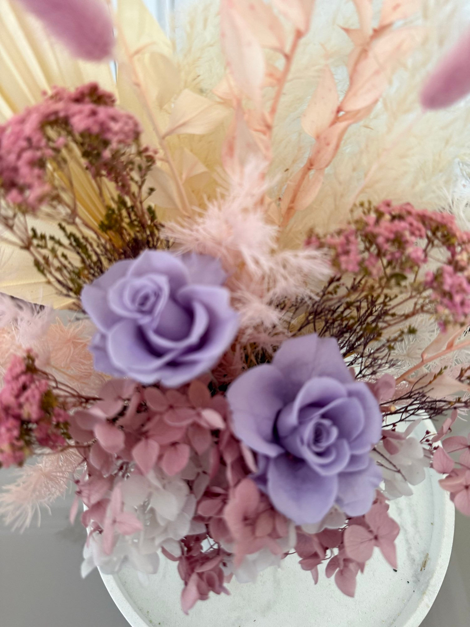Small lilac arrangement with double roses