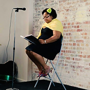 mica reading with yellow scarf