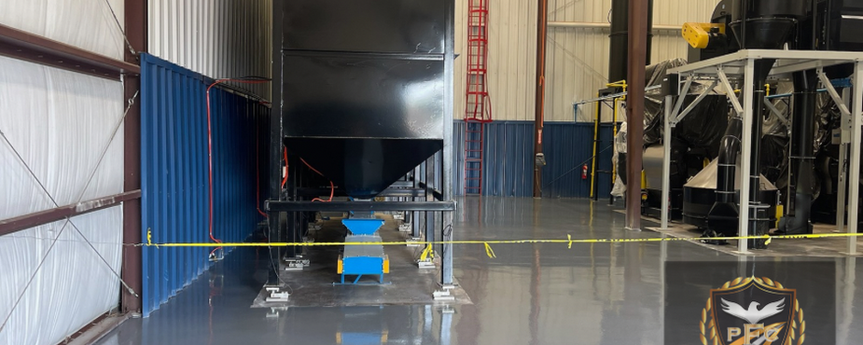 Platinum Floor Coatings epoxy flooring installation at Fresh Brew Coffee & Tea’s production area, featuring a whisper grey basecoat with a charcoal gray pigmented topcoat. Designed for easy maintenance and slip resistance, ensuring a clean, durable surface for coffee production operations.