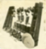 T. Green & Co. promotional image featuring brass helmets, hoses, boots, ladders and belts c. 1900s [Museum of Fire Collection]