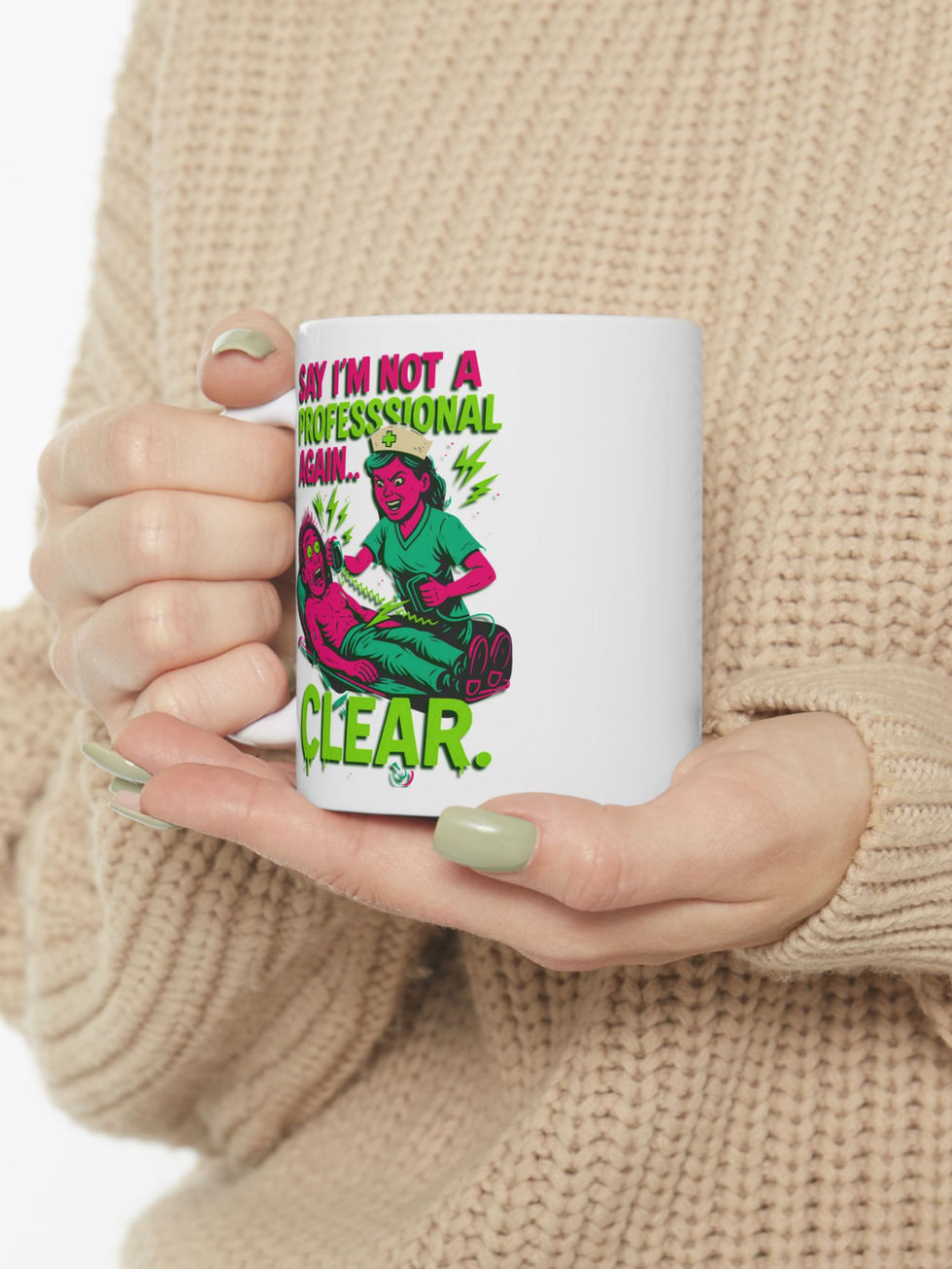 White ceramic mug Angry nurse using a defibrillator on a man with the text "Say I'm Not a Professional Again... CLEAR."