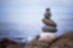 Close up picture of a stone cairn outdoo