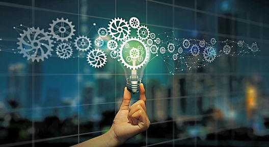 Businessman hand holding light bulb with cog inside. Business idea bulb gear icon network