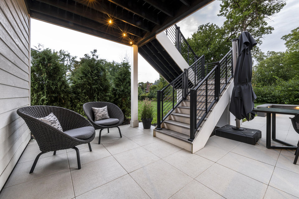 Unilock Arcana pavers with stairs and bistro.jpg