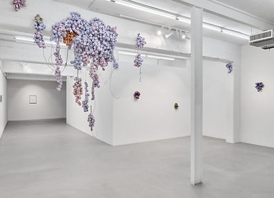 Luca Staccioli, Installation view, Falling flowers, 2025, ArtNoble Gallery, with a text by Rossella Farinotti,Sabotage of a working day 2025, concrete, cement resin, terracotta, glazed ceramic, marble dust, sand, steel cables, aluminium, screws, electrical clamps, electrical cables, electric motor, acrylic, earphones, mixed media. Variable dimensions, variable shape.