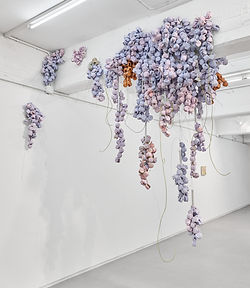 Luca Staccioli, Sabotage of a working day 2025, concrete, cement resin, terracotta, glazed ceramic, marble dust, sand, steel cables, aluminium, screws, electrical clamps, electrical cables, electric motor, acrylic, earphones, mixed media. Variable dimensions, variable shape.