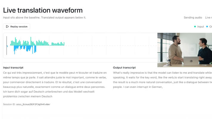 Live translation waveform interface showing a transcript graph and text. Two people stand beside a laptop, discussing. Bright, modern setting.