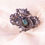 Thumbnail: Vintage Silver Flower Brooch with Blue Stone