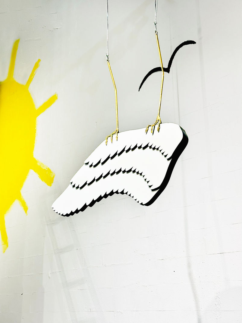 large scale Art installation by the Greek artist Esmeralda Kosmatopoulos featuring works inspired by the myths of Horus and Icarus presenting a wood sculpture of Icarus wing and bronze sculpture of falcon claw and talking about the Anthropocene and the relationship between men culture and nature