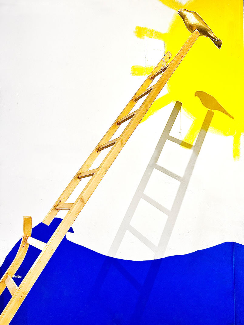 large scale Art installation by the Greek artist Esmeralda Kosmatopoulos featuring works inspired by the myths of Horus and Icarus presenting a wood sculpture of a broken ladder and a bronze sculpture of falcon Horus and talking about the Anthropocene and the relationship between men culture and nature