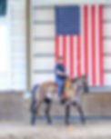 Paul in front of flag.jpeg
