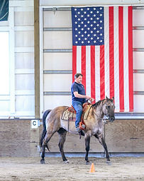 Paul in front of flag.jpeg