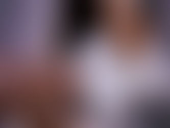 Woman in her fifties looking closely at her eyelids in the mirrorWoman in her fifties looking closely at her eyelids in the mirror