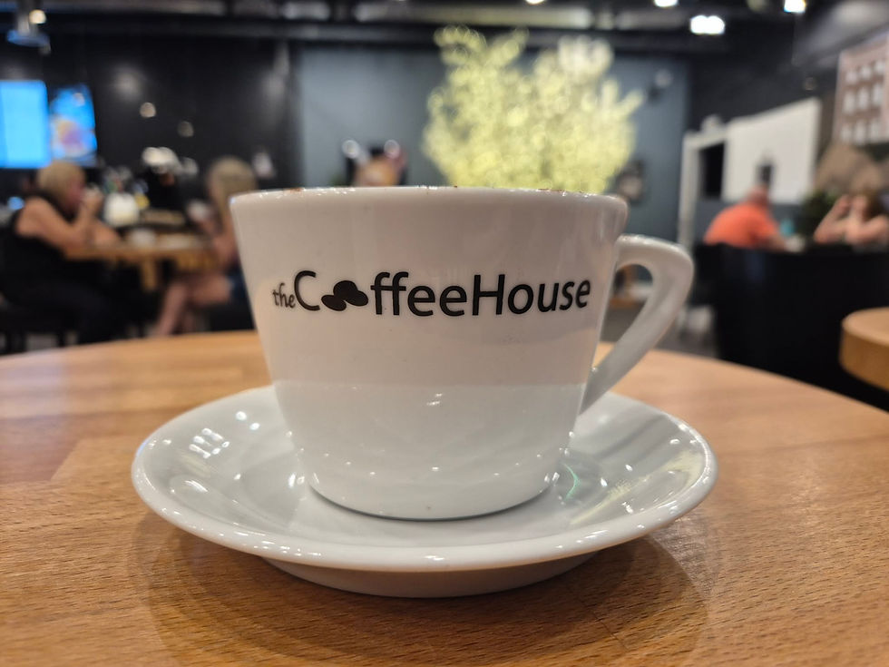 The Coffee House located on the ground floor at Units 21-22 in the Middleton Shopping Centre (M24 4EL).