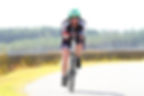 Female triathlete riding in a triathlon race