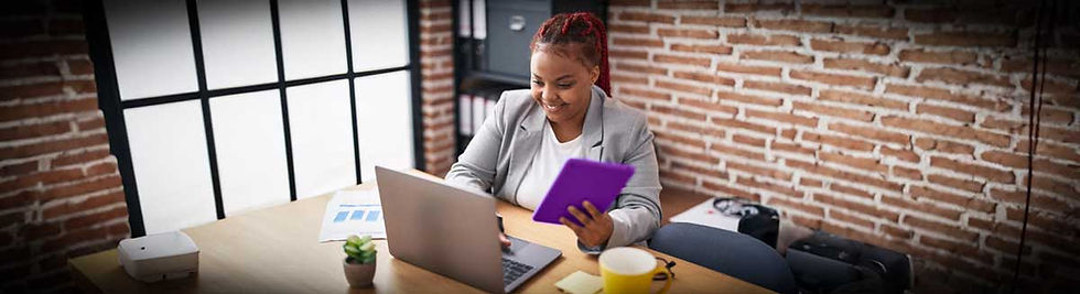 Person on a tablet and laptop