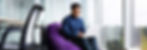 Person on a chair on a laptop