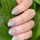 Thumbnail: Earthy Storm Grey swatch with leaves