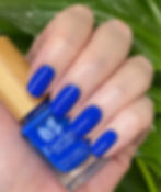 Earthy Poseidon Blue swatch with bottle