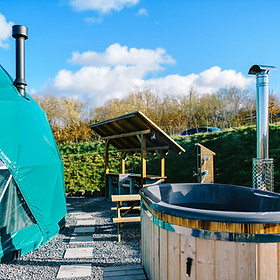 Dog friendly pods with wood fired hot tubs
