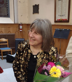 Susan at concert with flowers