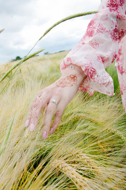 Engagement ring on a henna hand
