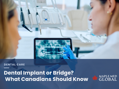 Dentist reviewing a panoramic x-ray with a patient before choosing a dental implant or bridge