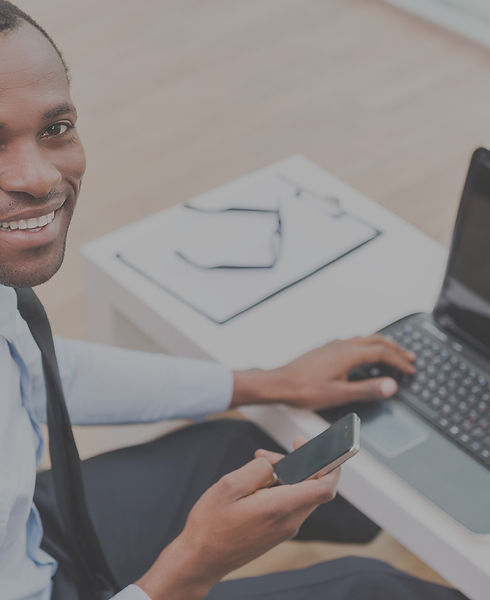 Smiling Man on Laptop_edited.jpg