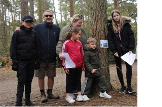 A family solving the clues on the Easter Egg Trail