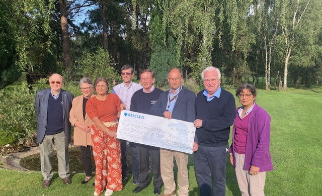 Rotary members presenting cheque to Fairstead Community Shop