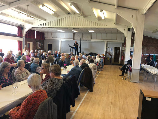 Harvest lunch 2022, everyone sitting down in anticipation