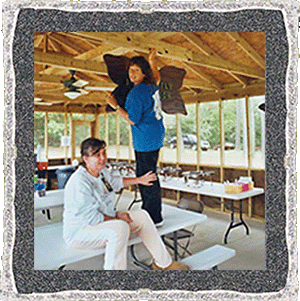 Lynda writing on rafter.gif