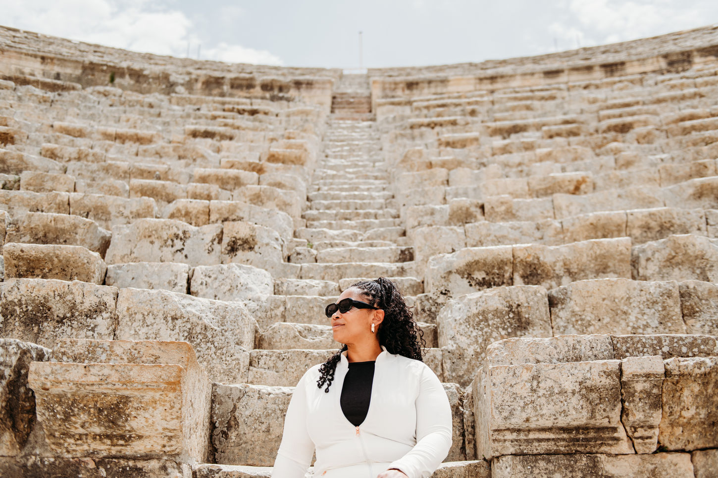 Architecture & Ruins:
• The Roman ruins of Jerash are adorned with stone columns and arches.
• Hadrian’s Arch at the entrance of Jerash.
• Oval Plaza surrounded by columns in Jerash, Jordan.
• Ancient Roman street with stone pavement in Jerash.
• Preserved Roman columns lining the streets of Jerash.
Theaters & Public Spaces:
• South Theater in the ancient city of Jerash.
• Stone seating inside a Roman theater in Jerash.
• Open courtyard and ruins at the Jerash archaeological site.
• Temple ruins with columns standing in Jerash.
• Wide view of Jerash’s ancient city layout.
Experience & Landscape:
• Visitors walking through the Roman ruins of Jerash.
• Families are exploring the historic streets of Jerash.
• Mountain backdrop surrounding the Jerash ruins.
• The sunlit ruins accentuate the grandeur of ancient Jerash.
• Panoramic view of the Jerash archaeological site.