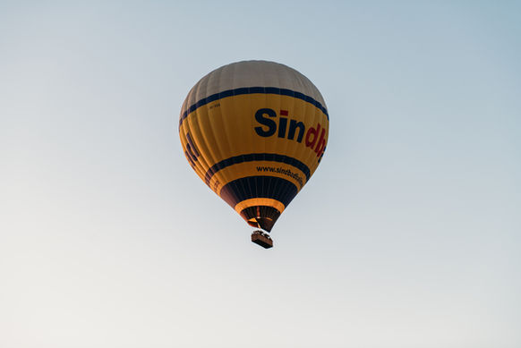 Balloon & Aerial Views:
• Hot air balloon flying over Luxor at sunrise.
• Aerial view of the Valley of the Kings from a balloon.
• Balloon drifting above the Nile River and farmlands.
• Sunrise light over Luxor’s desert and green fields.
• Wide shot of multiple balloons rising over Luxor.

Landmarks From Above:
• Aerial view of the Temple of Hatshepsut from the balloon.
• Desert landscape near the Valley of the Kings from above.
• Balloon view overlooking ancient tomb areas in Luxor.
• Scenic aerial shot of Luxor’s West Bank at sunrise.
• View of Luxor city from a hot air balloon.

Experience & Atmosphere:
• We were inside the hot air balloon basket during the sunrise flight.
• Burners lighting up inside the balloon before takeoff.
• Passenger looking out over Luxor from the balloon.
• Balloon shadow cast over the fields of Luxor.
• Balloon landing area in the Luxor desert.