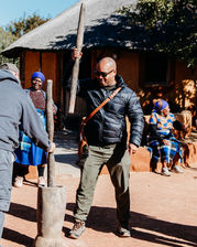 Cultural Demonstrations & Learning:
• Traditional dance performance at Bahurutshe Cultural Village.
• Bahurutshe dancers performing in traditional attire.
• Cultural guide explaining Botswana marriage customs.
• Demonstration of traditional marriage confirmation practices.
• Visitors learning about Botswana’s village names and history.
Family Interaction & Animals:
• Children playing with animals at Bahurutshe Cultural Village.
• Kids interacting with goats and livestock in the cultural village.
• Family exploring the Bahurutshe community with animals nearby.
• Child petting a village animal during the cultural visit.
• Kids learning about traditional village life in Botswana.
Dance & Community:
• Guests joining a traditional Bahurutshe dance.
• Circle dance celebrating Botswana culture.
• Bahurutshe performers teaching visitors traditional movements.
• Family participating in a cultural dance experience.
• Community members performing in the outdoor dance area.
Village Setting:
• Entrance to the Bahurutshe Cultural Village.
• Traditional huts and cultural structures in Botswana.
• Outdoor cultural village landscape.
• Family photo with Bahurutshe dancers.
• Cultural artifacts displayed at the Bahurutshe Village.