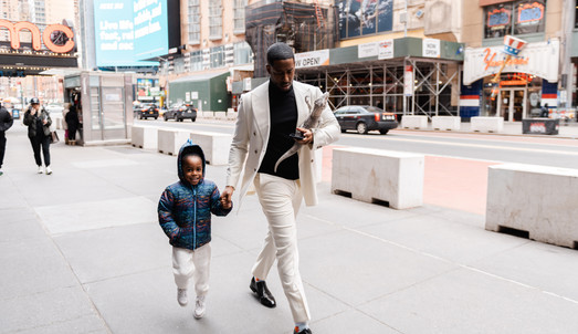 Keenan had meticulously arranged his proposal to Emilee, the love of his life, in the form of an unexpected surprise. In front of his family and close friends, Keenan popped the question to Emilee in the center of Times Square. "Will you be my wife?"