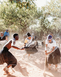 Cultural Demonstrations & Learning:
• Traditional dance performance at Bahurutshe Cultural Village.
• Bahurutshe dancers performing in traditional attire.
• Cultural guide explaining Botswana marriage customs.
• Demonstration of traditional marriage confirmation practices.
• Visitors learning about Botswana’s village names and history.
Family Interaction & Animals:
• Children playing with animals at Bahurutshe Cultural Village.
• Kids interacting with goats and livestock in the cultural village.
• Family exploring the Bahurutshe community with animals nearby.
• Child petting a village animal during the cultural visit.
• Kids learning about traditional village life in Botswana.
Dance & Community:
• Guests joining a traditional Bahurutshe dance.
• Circle dance celebrating Botswana culture.
• Bahurutshe performers teaching visitors traditional movements.
• Family participating in a cultural dance experience.
• Community members performing in the outdoor dance area.
Village Setting:
• Entrance to the Bahurutshe Cultural Village.
• Traditional huts and cultural structures in Botswana.
• Outdoor cultural village landscape.
• Family photo with Bahurutshe dancers.
• Cultural artifacts displayed at the Bahurutshe Village.