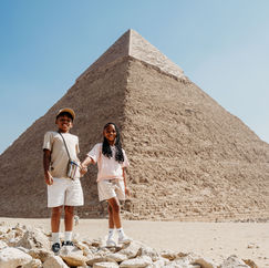 • The Great Pyramid of Giza and the Sphinx on the Giza Plateau.
• A traveler is exploring the Pyramids of Giza in Cairo.
• Interior displays and artifacts at the Grand Egyptian Museum.
• The Citadel of Cairo provides a view of the Mohamed Ali Mosque.
• The architecture and interior details of the Mohamed Ali Mosque are noteworthy.
• Walking through Moez Street in Cairo’s historic district.
• Traditional shops and Islamic architecture along Moez Street.
• Sunrise: hot air balloon flying over Luxor.
• Aerial view of Luxor’s farmlands and ancient sites from a balloon.
• Entrance to the Valley of the Kings in Luxor.
• Tomb artwork and details inside the Valley of the Kings.
• Front view of the Temple of Hatshepsut built into the cliffs.
• The Colossi of Memnon statues in Luxor.
• Rows of giant columns inside Karnak Temple.
• Hieroglyphs and architecture at Karnak Temple.
• Luxor Temple illuminated at dusk.
• The statues and columns at Luxor Temple are illuminated at night.