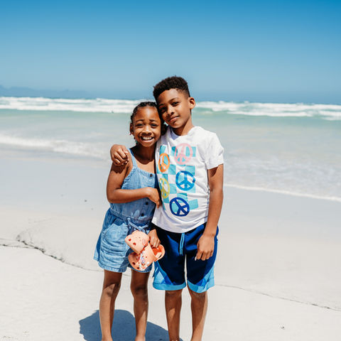 • The family is enjoying time together at Camps Bay Beach in Cape Town.
• The family is strolling along Camps Bay, with the mountains providing a picturesque backdrop.
• The family enjoys moments together at Muizenberg Beach, surrounded by colorful beach huts.
• Kids playing near the ocean at Muizenberg Beach.
• Family enjoying a sunny beach day in Cape Town.
• Relaxed family photo on the sand at Camps Bay.
• Family beach walk along Cape Town’s coastline.