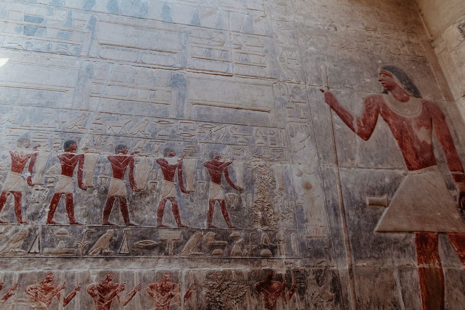 Pyramid & Structures:
• Step Pyramid of Djoser in Saqqara, Egypt.
• Wide view of the Step Pyramid rising over the desert.
• Ancient stone structure at the Saqqara archaeological site.
• Entrance to tombs at Saqqara’s necropolis.
• Saqqara pyramid complex under clear sky.

Tombs & Carvings:
• Hieroglyphic carvings inside a Saqqara tomb.
• Wall relief showing ancient scenes at Saqqara.
• Old stone corridor inside a Saqqara burial chamber.
• Detailed carvings inside the Mastaba tombs.
• Preserved artwork from ancient Egypt at Saqqara.

Landscape & Experience:
• Visitor walking toward the Step Pyramid in Saqqara.
• Desert landscape surrounding Saqqara ruins.
• Family exploring the Saqqara archaeological area.
	•	Scenic view of Saqqara’s historic structures.
• Photo of the Saqqara complex with blue sky backdrop.