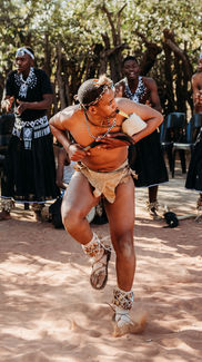 Cultural Demonstrations & Learning:
• Traditional dance performance at Bahurutshe Cultural Village.
• Bahurutshe dancers performing in traditional attire.
• Cultural guide explaining Botswana marriage customs.
• Demonstration of traditional marriage confirmation practices.
• Visitors learning about Botswana’s village names and history.
Family Interaction & Animals:
• Children playing with animals at Bahurutshe Cultural Village.
• Kids interacting with goats and livestock in the cultural village.
• Family exploring the Bahurutshe community with animals nearby.
• Child petting a village animal during the cultural visit.
• Kids learning about traditional village life in Botswana.
Dance & Community:
• Guests joining a traditional Bahurutshe dance.
• Circle dance celebrating Botswana culture.
• Bahurutshe performers teaching visitors traditional movements.
• Family participating in a cultural dance experience.
• Community members performing in the outdoor dance area.
Village Setting:
• Entrance to the Bahurutshe Cultural Village.
• Traditional huts and cultural structures in Botswana.
• Outdoor cultural village landscape.
• Family photo with Bahurutshe dancers.
• Cultural artifacts displayed at the Bahurutshe Village.
