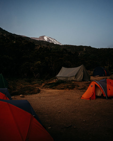 Camping tents with Mount Kilimanjaro in background, a Tanzania travel destination.